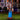 Inflatable grim reaper scarecrow holding a scythe, blue light shining through body.