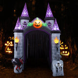 Inflatable haunted castle entrance with lit jack-o'-lantern and flaming torch lights