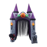Inflatable haunted castle doorway with striped curtain, purple towers, jack-o'-lantern light