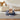 Round plush pet bed with ear-shaped bolsters, dark blue-gray, soft inner cushion