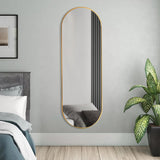 Gold oval full-length wall mirror with slim metal frame