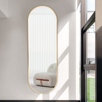 Gold oval full-length wall mirror with slim metal edge