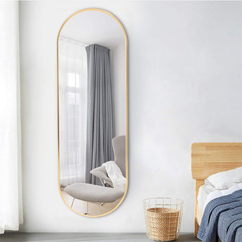 Gold oval full-length wall mirror with slim metal frame