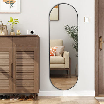 Black oval full-length wall mirror with slim metal frame