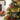 Christmas ball ornament with red plaid and green-striped design, plus hanging loop