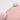 Pink cotton rope basket fabric weave and pom-pom detail close-up