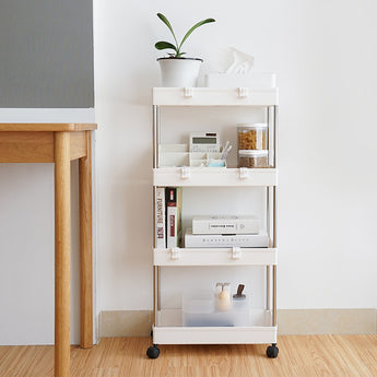 White rolling storage rack with 4 open shelves, organizing items in a narrow corner