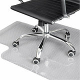 Chair caster wheels on gray non-slip PVC mat with dotted grip texture