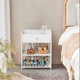 White bedside table with drawer and open 3-tier shelves, decorative cutout sides