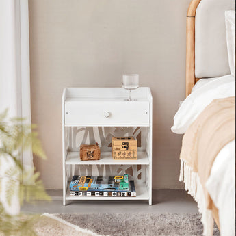 White bedside table with drawer and open 3-tier shelves, decorative cutout sides