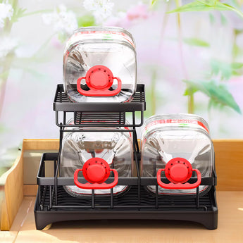 Black steel dish rack with two glass-holding tiers and utensil slots