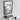 Black framed bathroom mirror with lower shelf and visible glass reflection through