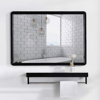 Black bathroom mirror with shelf and thick frame, long ledge beneath the glass
