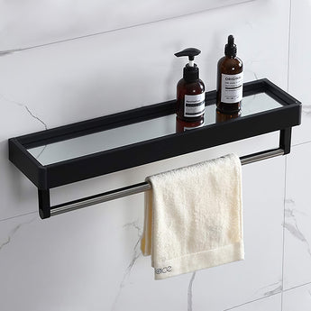 Black framed bathroom mirror with shelf ledge, shown with bottles and towels on