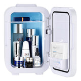 White mini makeup fridge open: two compartments with skincare bottles and packets
