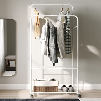 White clothes rack with two-tier hanging space and bottom shelf, on casters