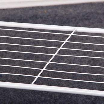 Close-up of white hanging-bar grid for organizing clothes on the rack