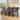 Set of dark gray velvet button-tufted wooden bar stools with nailhead trim and arched backs