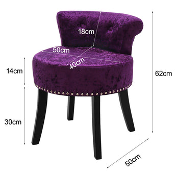 Velvet dark purple dressing stool with curved back, silver studs, and black tapered legs
