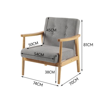 Grey tufted upholstered armchair with wide armrests and square wooden legs