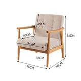 Beige tufted upholstered armchair with wide armrests and square wooden legs