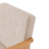 Close-up of beige upholstered armchair back corner and light wood arm support
