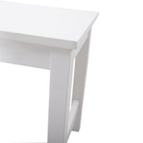 White pine bench leg and open cross-brace detail under the tabletop