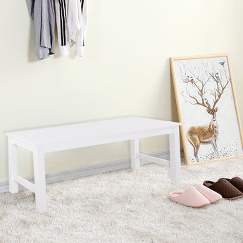White pine bench with flat top and open side frames, supported by sturdy legs