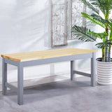 Pine wood bench with slatted-style side supports, light top and gray-blue frame.