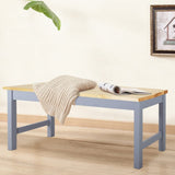 Pine wood bench with light pine seat plank and gray-blue sturdy legs.