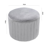 Light gray round velvet ottoman pouf with vertical channel stitching and round top
