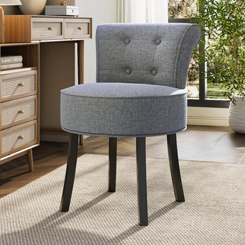 Grey linen vanity stool with tufted back and round seat, black wooden legs