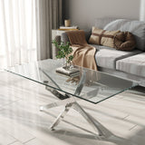 Glass-top metal table with chrome X base and clear tabletop, side angle
