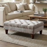 Grey velvet ottoman footstool with button-tufted top and gourd-shaped wooden legs