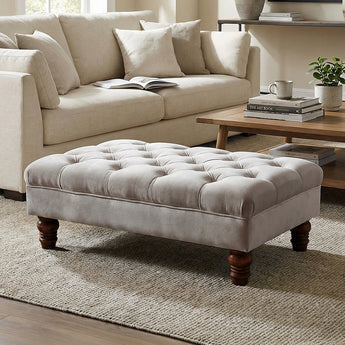 Grey velvet ottoman footstool with button-tufted top and gourd-shaped wooden legs