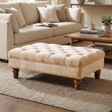 Light beige velvet ottoman footstool with button-tufted top and gourd-shaped legs