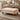 Light beige velvet ottoman footstool with button-tufted top and gourd-shaped legs