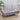 Rectangular velvet footstool with tufted top and gray upholstery