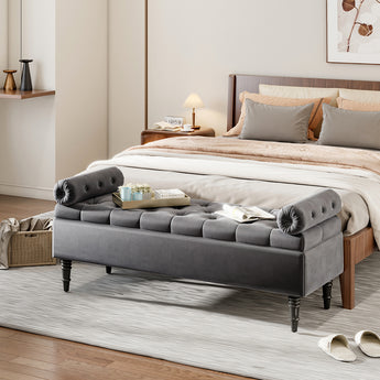 Grey velvet upholstered storage bench with tufted sides and cushioned top