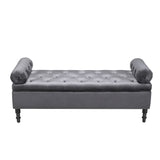 Grey velvet storage bench with tufted arms and button tufted top