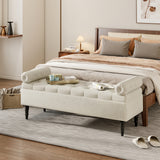 Beige linen upholstered storage bench with tufted ends and dark wooden legs