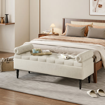 Beige linen upholstered storage bench with tufted ends and dark wooden legs