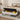 Beige linen storage bench with open lid showing dark interior and yellow accents