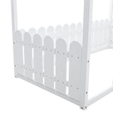 Close-up of white scalloped fence guard rails on house toddler bed frame