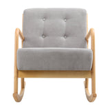 Grey upholstered rocking lounge chair with button-tufted back and light wood arms