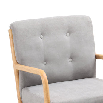 Grey upholstered rocking chair backrest with button tufting and light wood arm supports
