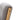 Light wood arm corner on grey upholstered rocking chair with visible mounting hardware