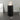 Black 3-tier plastic storage unit with three open drawers and circular handles