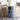 Grey 3-tier plastic storage unit with three front drawers and round pull holes