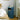 Blue cylindrical 3-drawer plastic storage unit with open top drawer and round pull